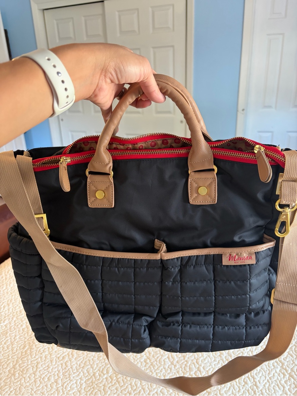 Black Quilted Baby Bag with Tan Trim and Red Interior Accent